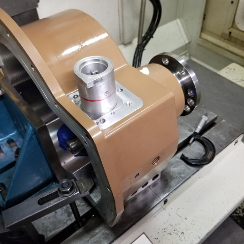 Machining custom gear box for hydraulic pump drive.